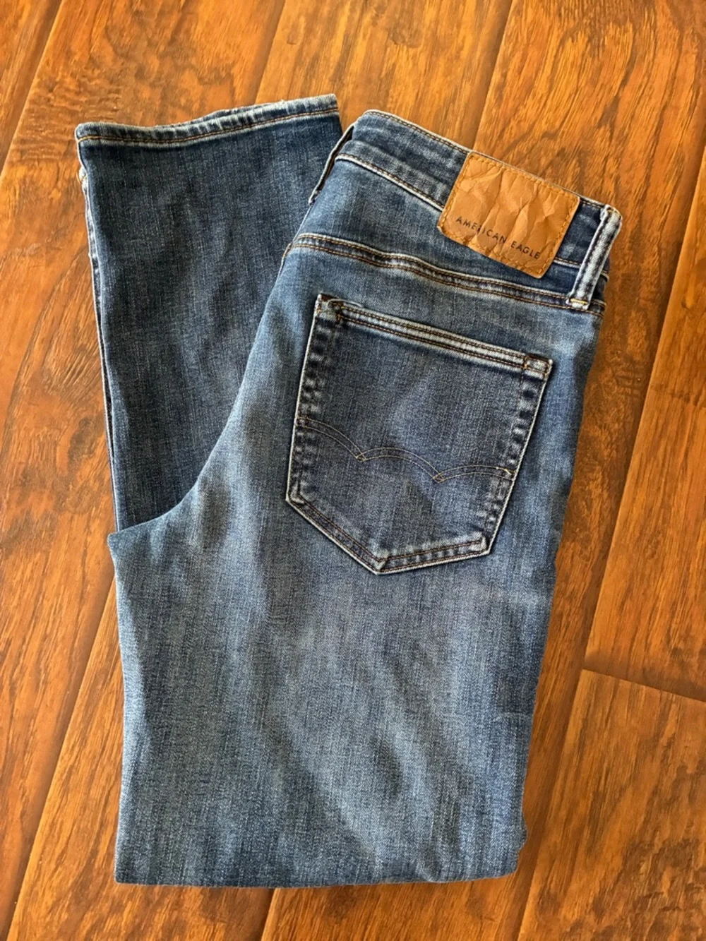 American Eagle Outfitters Men’s Medium Blue Slim Straight Jeans with Tan Patch - Picture 1 of 6